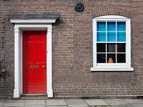 Traditional Georgian terraced house with red front door